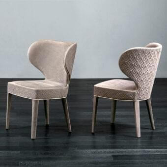 Superior Rugiano Aida chair crafted with wood and plush textured fabric in a warm beige tone with satin-finish legs