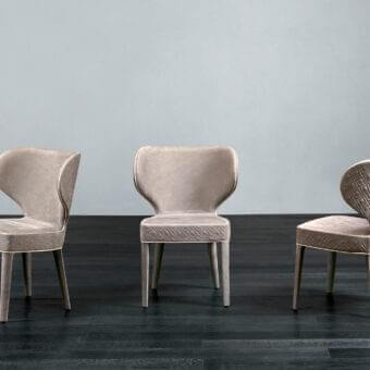 Distinctive Rugiano Aida chair with neutral beige luxurious fabric upholstery and lacquered slender legs