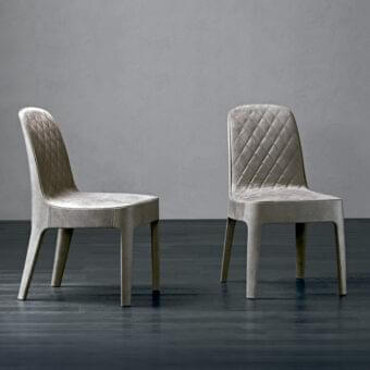 Elegant Rugiano Aria chair upholstered in muted grayish-beige fabric with refined matelassé quilted embroidery and polished lacquered wood legs