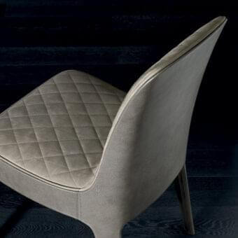 Superior Rugiano Aria chair with light gray quilted leather and crafted legs for a sophisticated seating experience
