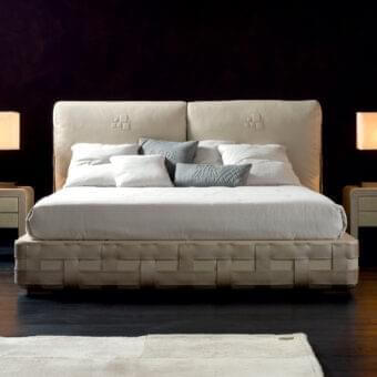 Sophisticated Rugiano Braid bed with light beige textile and steel accents displaying a braid decoration in matching technobuk