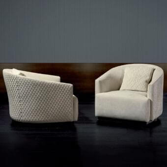 Distinguished Rugiano Opera lounge chair with light beige fabric upholstery and dark-toned wood base crafted with a quilted back detail