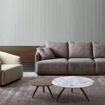Distinguished Rugiano Opera sofa upholstered in muted taupe textile with matte finish and steel metal base
