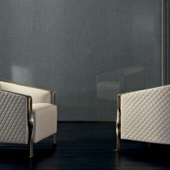 Distinguished Rugiano Paris lounge chair with light beige quilted fabric upholstery and glossy gold twisted metal structure