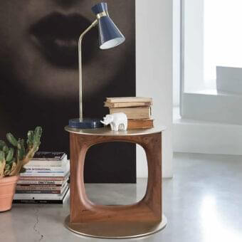 Distinguished Porada Tenco side table in solid Canaletto walnut with a brushed brass metal top and sculpted frame