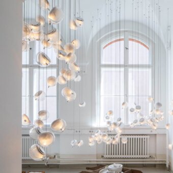 Distinguished Bocci 76 Single Suspension Lamp with hot white and clear glass plus copper mesh detailing crafted with a translucent gold tone