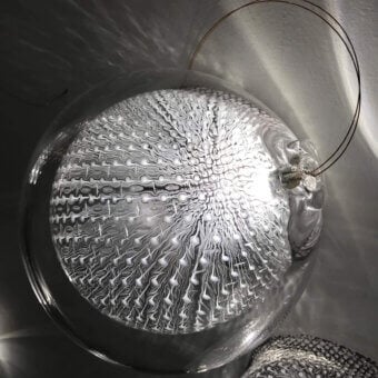 Exceptional Bocci 76 Surface Light crafted in hot white and clear glass with delicate copper mesh detailing and glossy finish
