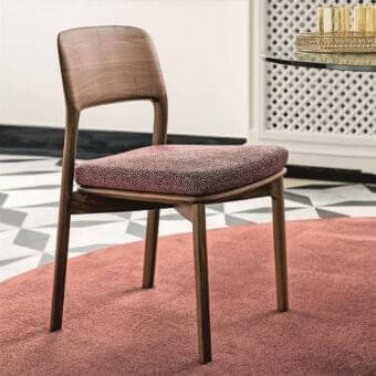 Exceptional Porada Emma chair with sculpted Canaletto walnut wood and muted pinkish-purple fabric upholstery with satin finish