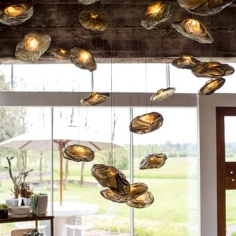 Exceptional Bocci 73 suspension lamp with clusters of hand-blown glass pendants crafted in golden-brown ceramic fabric creating warmly diffused light