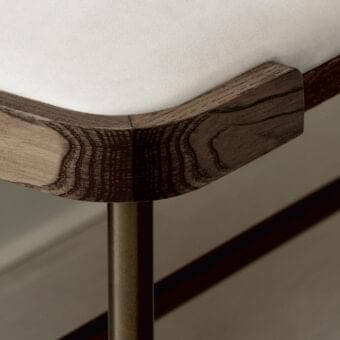 Distinguished Porada Astol bench with a bronze finished metal base and solid ash wood frame upholstered in white textile or synthetic leather