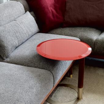 Distinguished Porada Jok side table with red matt lacquered tabletop and Canaletto walnut pole built with a black chromed metal base