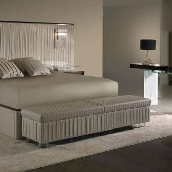 Lavish Reflex Plissé XL bed with light beige pleated fabric, shiny metal accents and ebony wood details