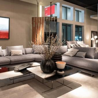 Superior Arketipo Self Control sectional with light gray textile upholstery and black nickel feet
