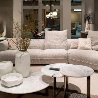 Distinguished Arketipo Starman sectional crafted in Italy with curved lines and a textured neutral textile upholstery