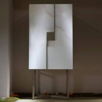 Exclusive Reflex Musa cupboard with pale off-white and light grey veined Marble glass, satin finish and bronze-finished metal base