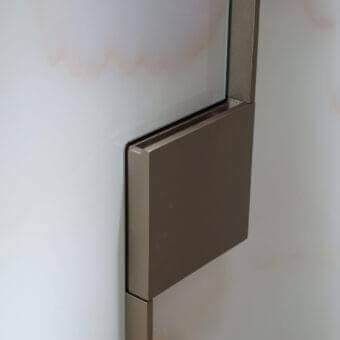 Sophisticated Reflex Musa cupboard with geometric forms built in wood and Marble glass with a bronze finish