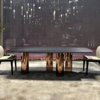 Exceptional Reflex Signore degli Anelli table with dark patterned Marble glass and reflective copper-toned metallic cylindrical legs crafted with a smooth finish