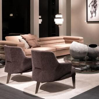 Distinguished Arketipo Nascar lounge chair with dark purplish-brown woven textile upholstery and black nickel metal structure