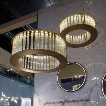 Exceptional Reflex Comete suspension lamp with transparent glass elements and a glossy golden metal framework