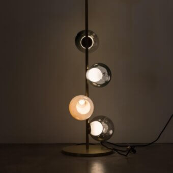 Elegant Bocci 28 Stem Floor Lamp with satin brass finish and uniquely distorted clear, milk white glass exterior spheres