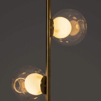 Distinguished Bocci 28 Stem Floor Lamp with a slender brass stem and captivating clear glass spheres housing milk white lamp holders