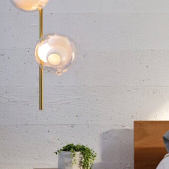 Superior Bocci 38V Stem ceiling lamp with a slender brass stem supporting clear glass spheres and milk white lamp holders