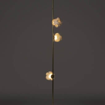 Captivating Bocci 38V Stem floor lamp with brass finish and clear glass shades casting a warm glow
