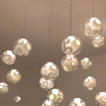 Captivating Bocci 38V Single Suspension Lamp lighting fixture crafted in clear glass with milk white interior cavities