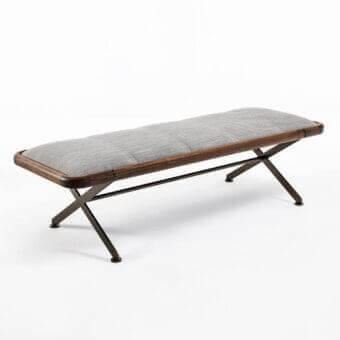 Padded light gray surface with dark brown wood-like frame rests on angled dark metal legs forming an X-shaped base