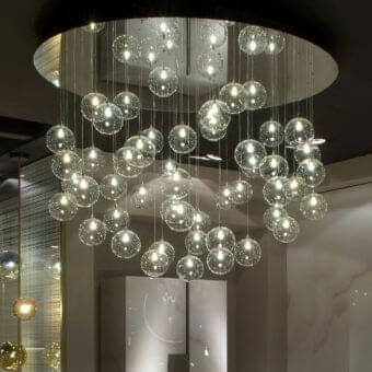 Distinguished Reflex Bulles suspension lamp with clear glass spheres and delicate metal cables in a glossy finish