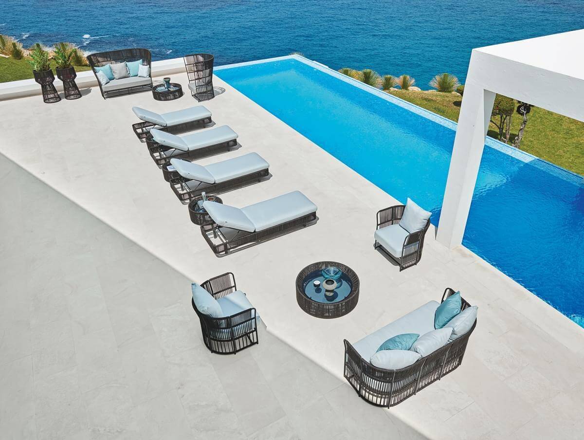 Lavish Varaschin Tibidabo lounge chair with Silk Grey structure and Perla Rope weaving in light blue cushions