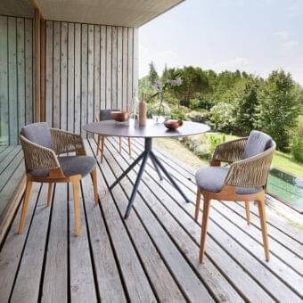 Refined Potocco Velis armchair with woven “Gassa” cord and solid Iroko wood, upholstered in gray outdoor finish