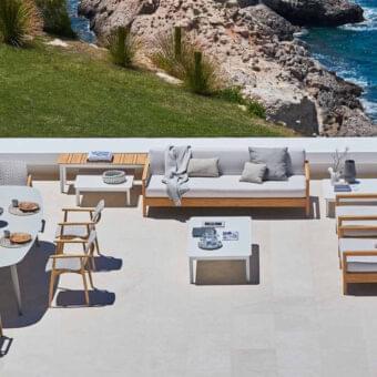 Elegant Varaschin Bali sofa with plantation-certified solid teak and light gray Dryfeel cushions offers a contemporary aesthetic
