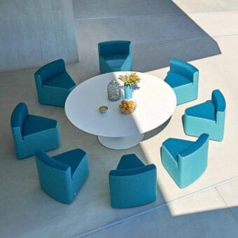 Exceptional Varaschin Big In&out table and chairs set with matte white HPL and teal blue weather-resistant fabric upholstery built with okoumè wood