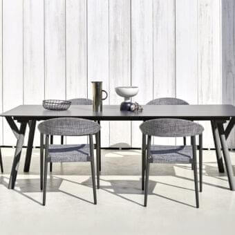 Refined Varaschin Clever armchair with a durable powder-coated aluminum frame and heathered gray VAR#TEX upholstery