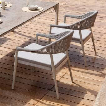 Stylish Varaschin Clever armchair with a powder-coated aluminum frame and hand-woven synthetic cord backrest in light grey cushioning