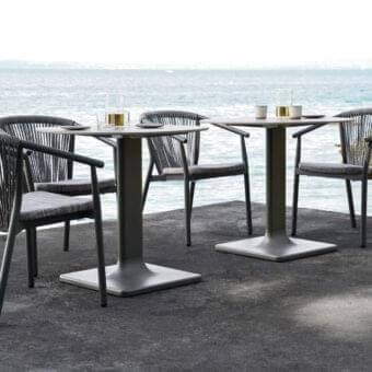 Elegant Varaschin Smart armchair with dark-toned VAR#TEX PVC mesh and powder-coated aluminum structure