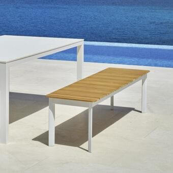 Refined Varaschin System bench with honey teak wood seat and matte white powder-coated aluminum frame