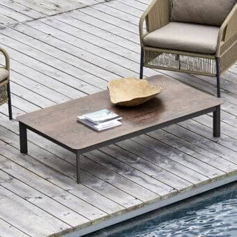 Distinguished Varaschin System coffee table with a textured medium brown HPL tabletop and dark gray powder-coated aluminum base