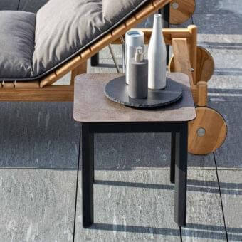 Exceptional Varaschin System side table with dark, mottled Hpl top and powder-coated aluminum frame crafted for outdoor use