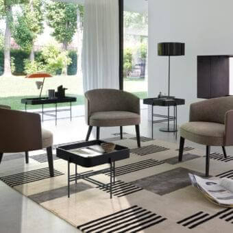 Elegant Potocco Lena lounge chair in muted brown-gray textile with solid ash legs and dark matte finish