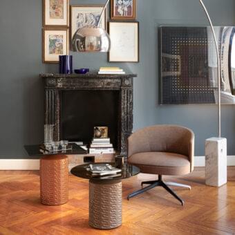 Superior Potocco Lena lounge chair with curved brown textile upholstery and black metal four-legged base