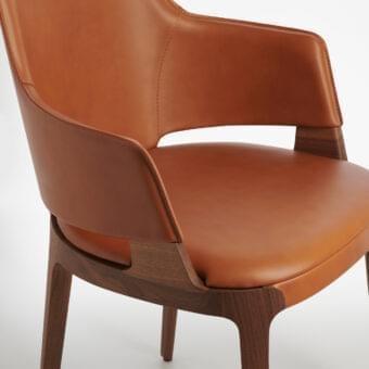 Exceptional Potocco Velis armchair with supple tan leather upholstery and meticulously crafted dark brown Canaletto walnut frame