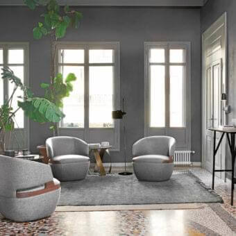Superior Potocco Velis lounge chair with a rotating base upholstered in matte grey fabric and Canaletto walnut armrests
