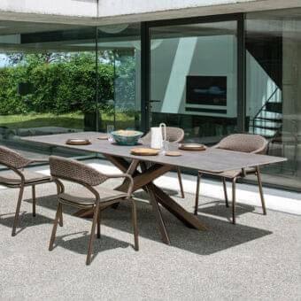 Refined Varaschin System Star table with extruded aluminum base and durable HPL tabletop in muted gray with textured matte finish