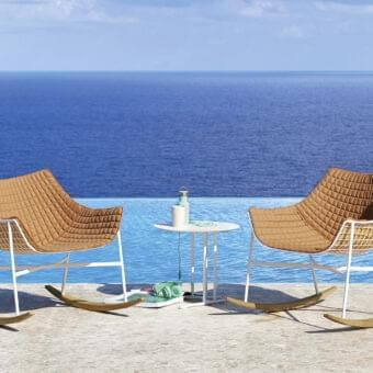 Refined Varaschin Summer Set rocking lounge chair with warm brown quilted cushions and white powder-coated steel with teak runners