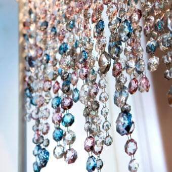 Exclusive Masiero Olà floor lamp with slender metal frame and coated Italian glass pendants in clear, blue, pink hues with glossy finish