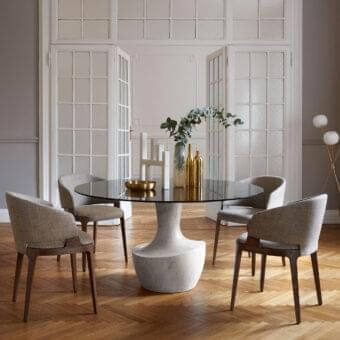 Distinguished Potocco Anfora table with sculpted marble base and sleek round glass top crafted in Italy