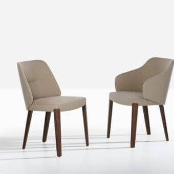 Exceptional Potocco Concha armchair with enveloping form upholstered in light beige textile and oak legs with dark finish