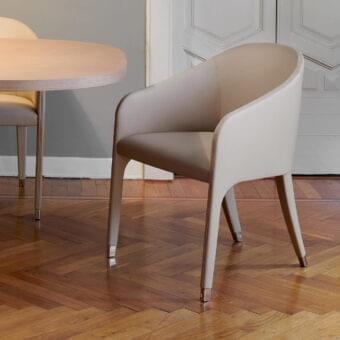 Exceptional Potocco Miura armchair with gently curved form and neutral beige textile upholstery built with tapered metal legs